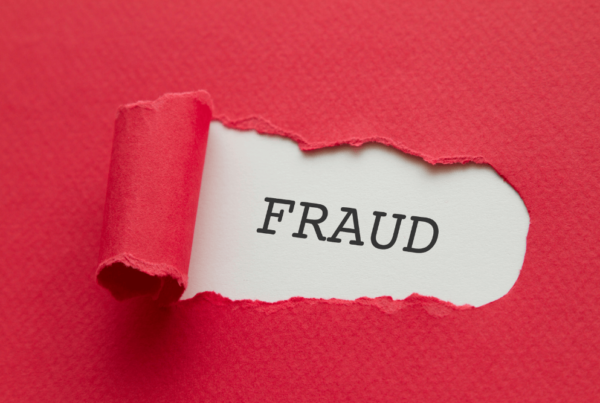 understanding wire fraud image with fraud in the middle of the image with red paper